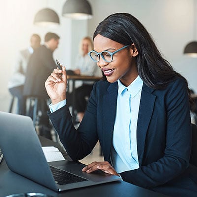 Female professional viewing data in computer