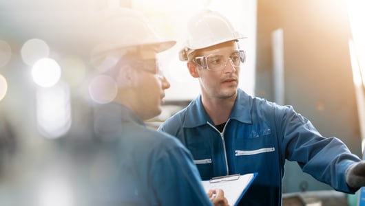 Two workers in a factory