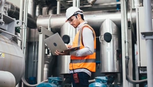 Worker on a computer in a factory