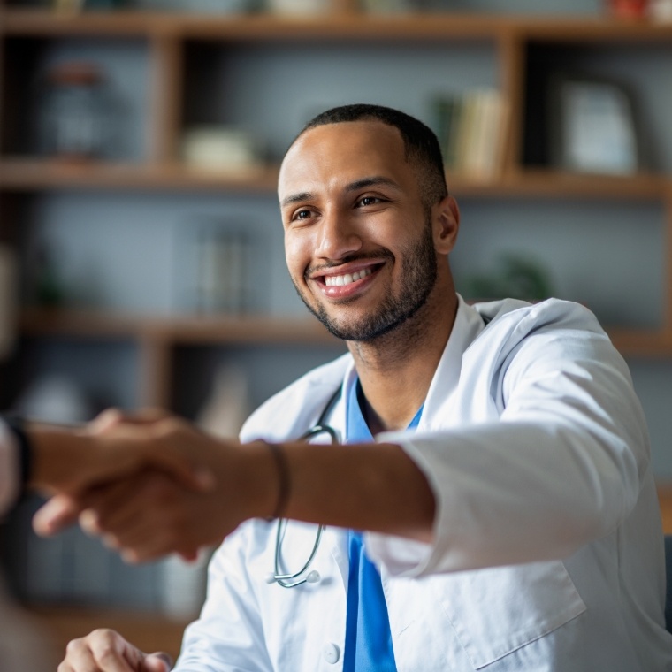 Doctor shaking hands with patient