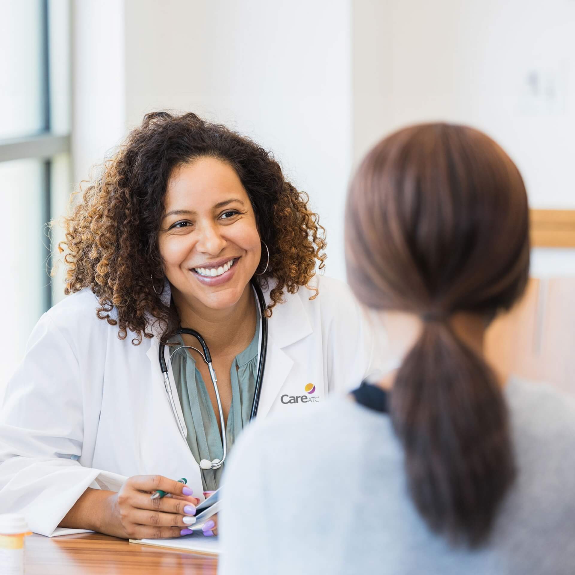 Doctor helping patient