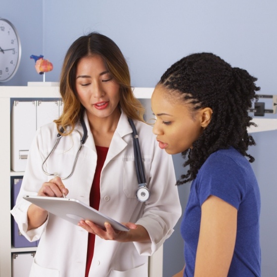 Woman Doctor helping patient